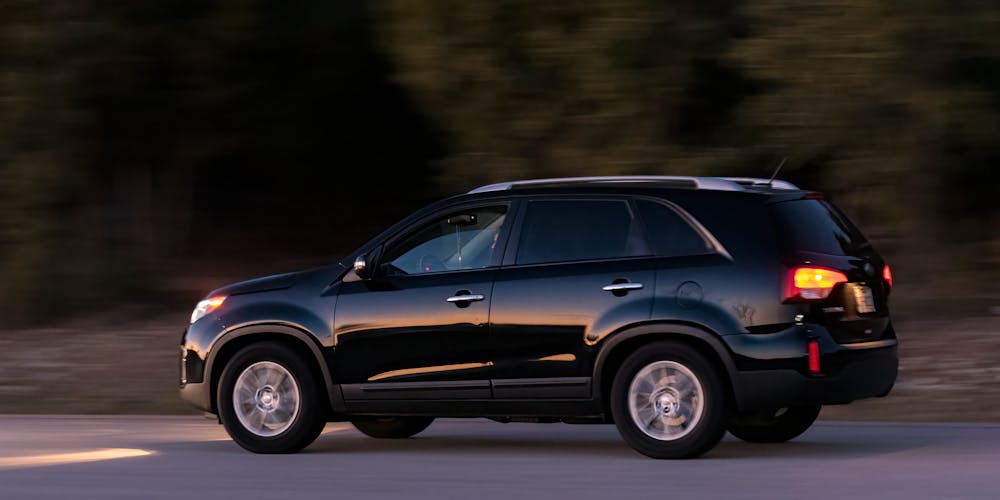 Black SUV driving on the road