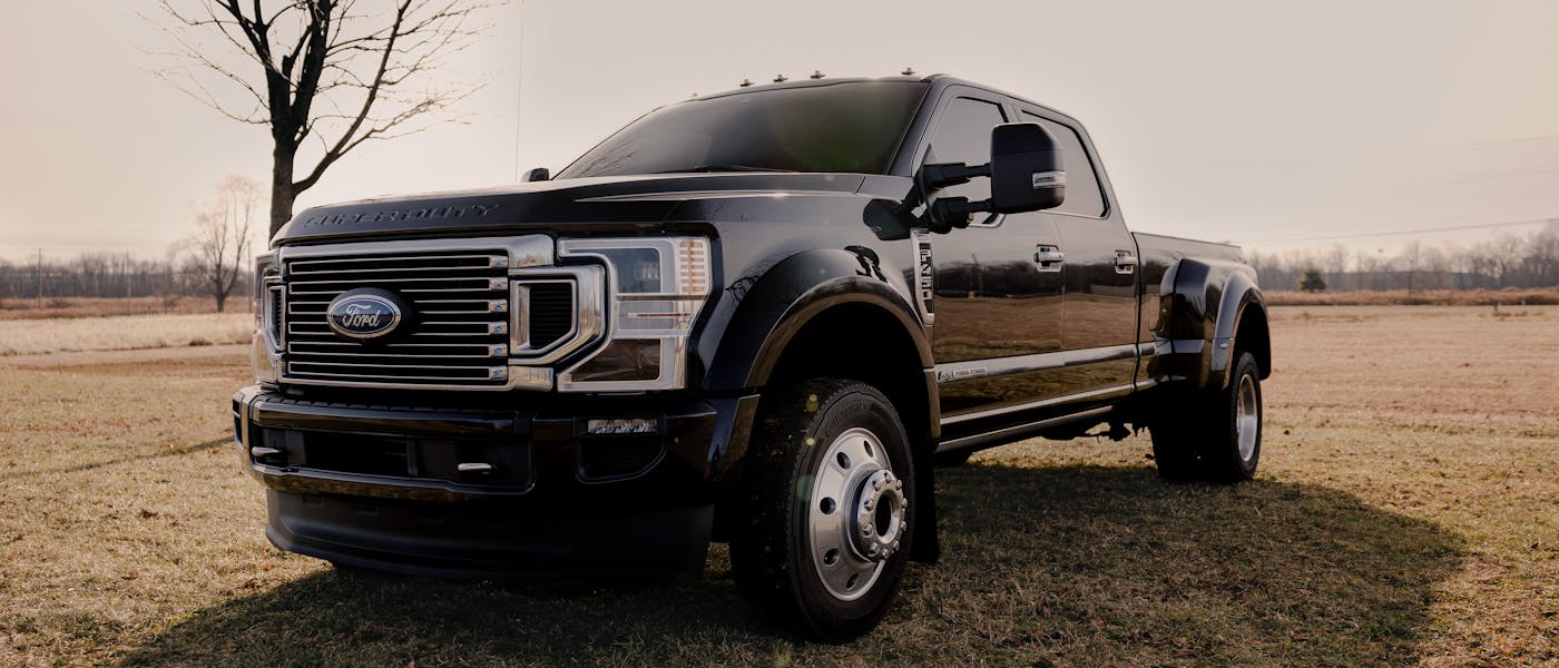 White Ford F-150 crew cab pickup truck